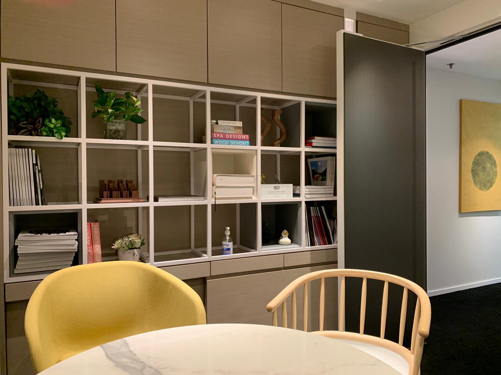 Floor-to-ceiling built-in shelving in a compact Hong Kong interior, showing space-saving storage planning