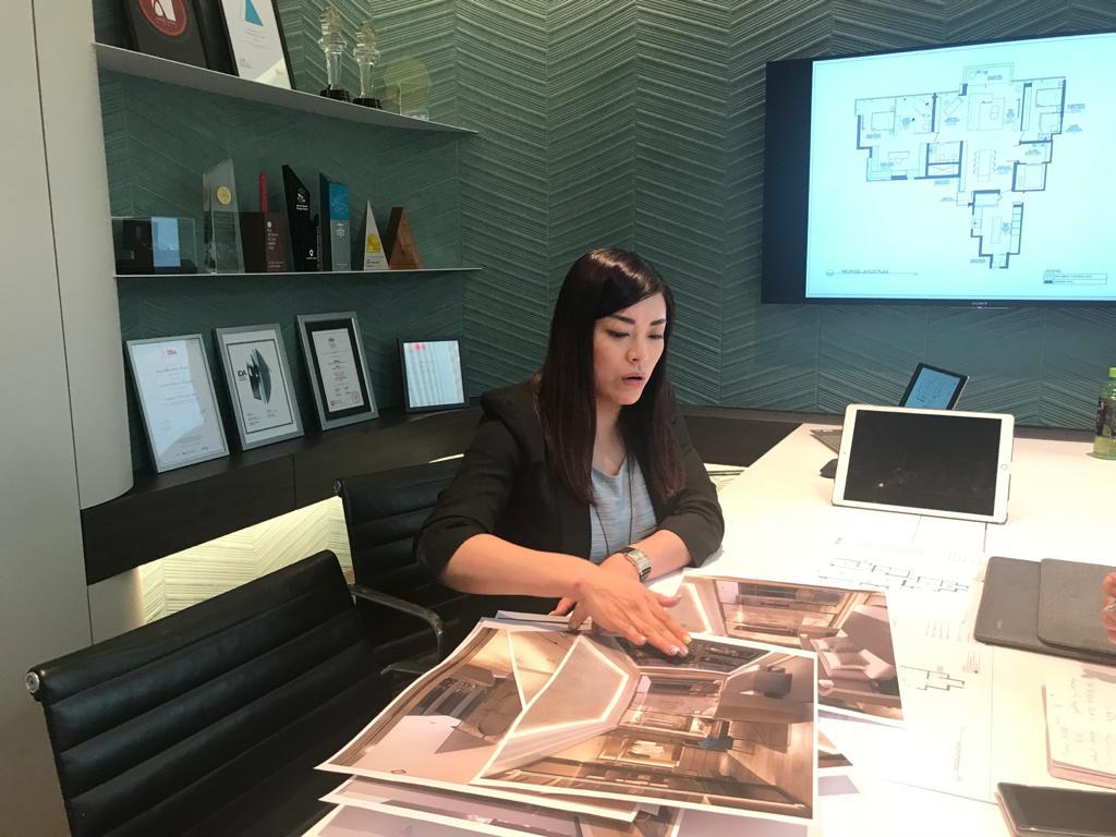 Regina Kwok going through a pre-renovation checklist with a client at the Artwill studio