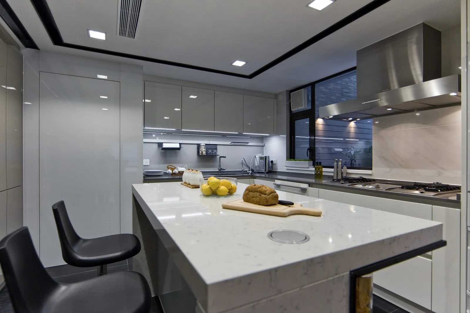 Kitchen material samples including worktop and cabinet finishes laid out for a Hong Kong kitchen design